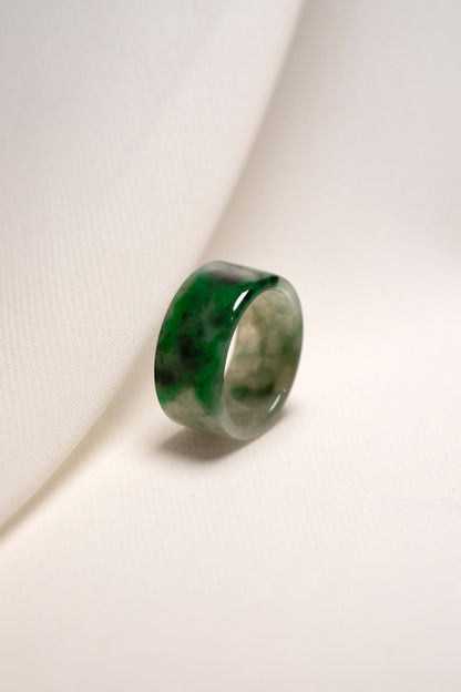 White Jadeite Ring with Medium Green and Black Patches