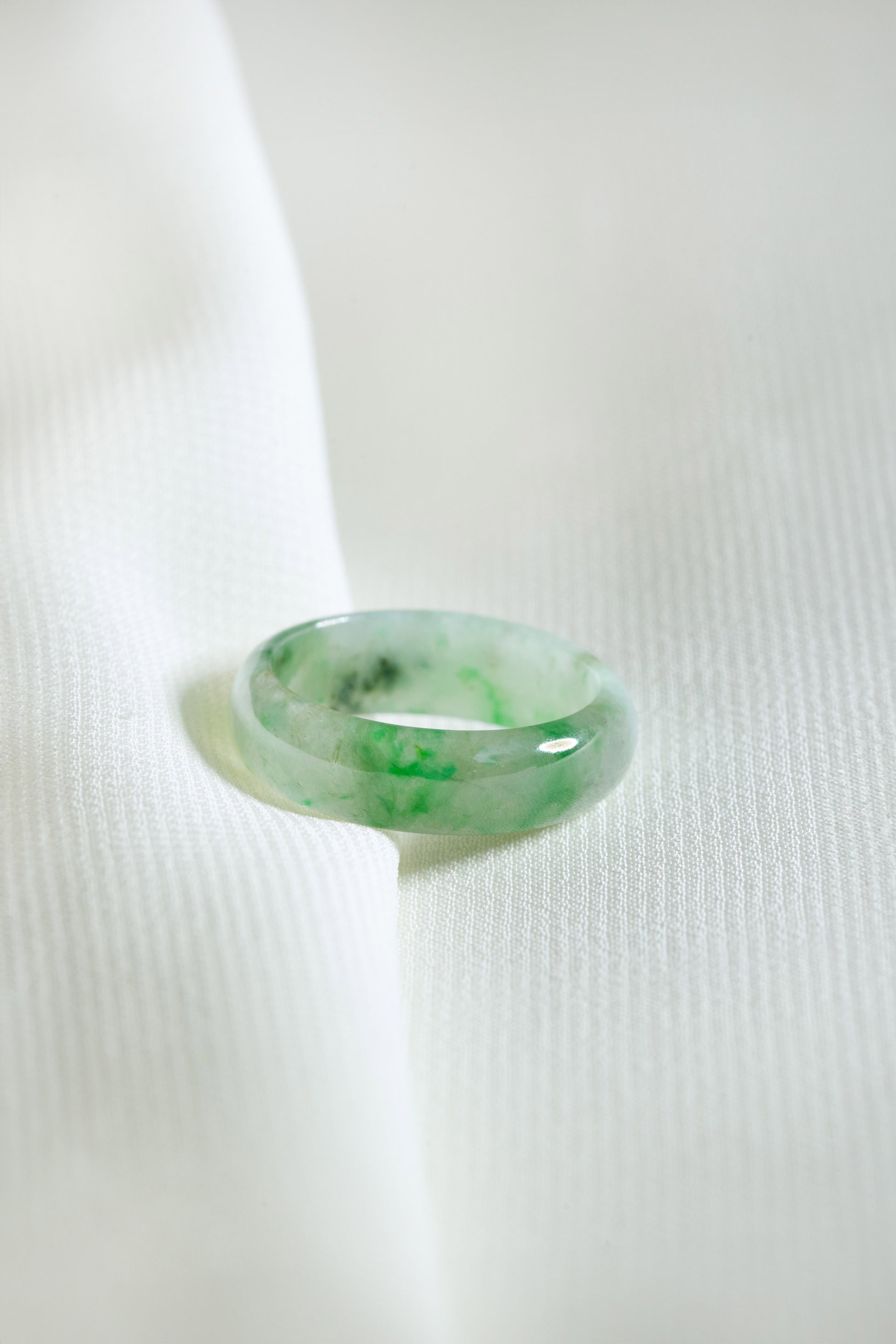 Intense Green Jadeite Ring with Pale Green patches
