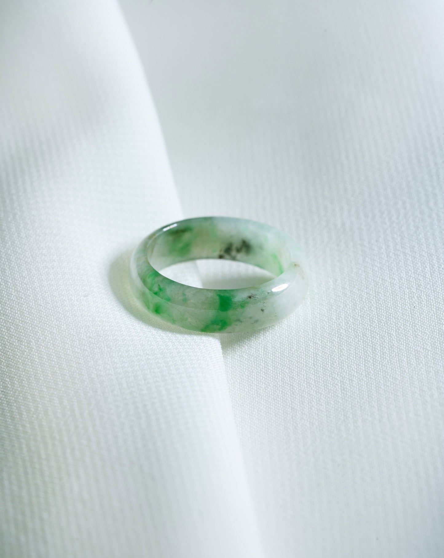 Intense Green Jadeite Ring with Pale Green patches