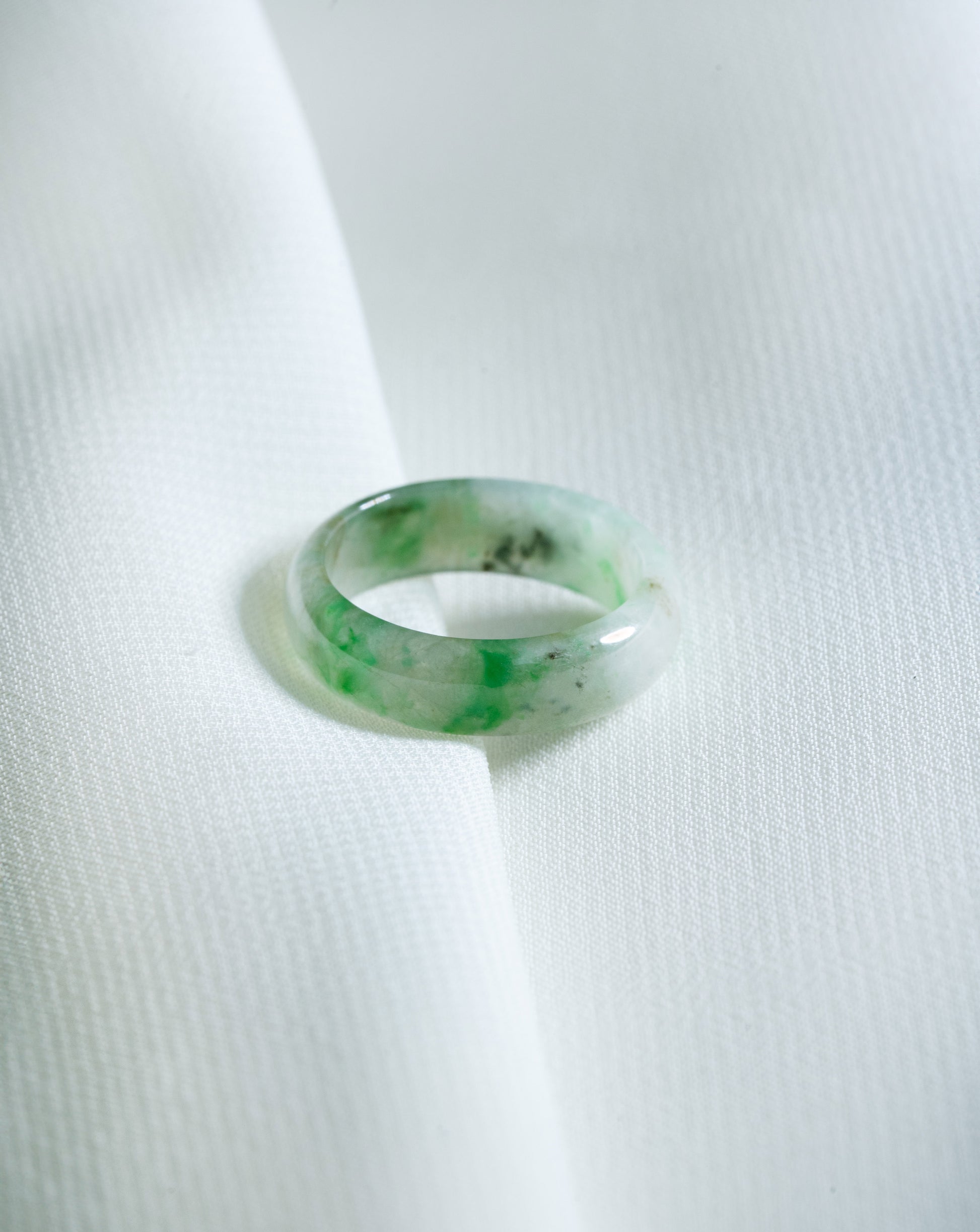 Intense Green Jadeite Ring with Pale Green patches