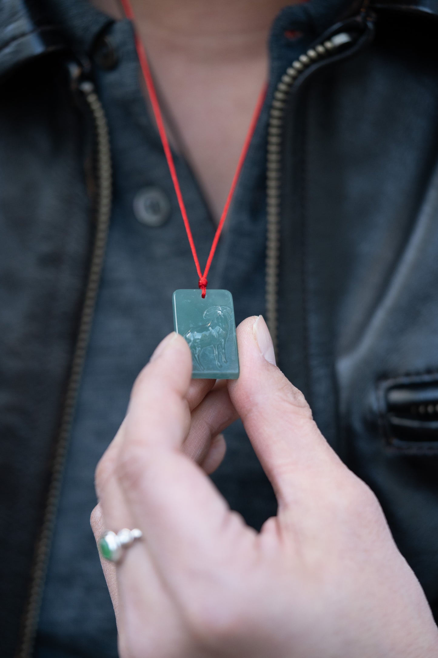 Zodiac Goat in Bluish Green Jadeite Jade Pendant hung on a red string 