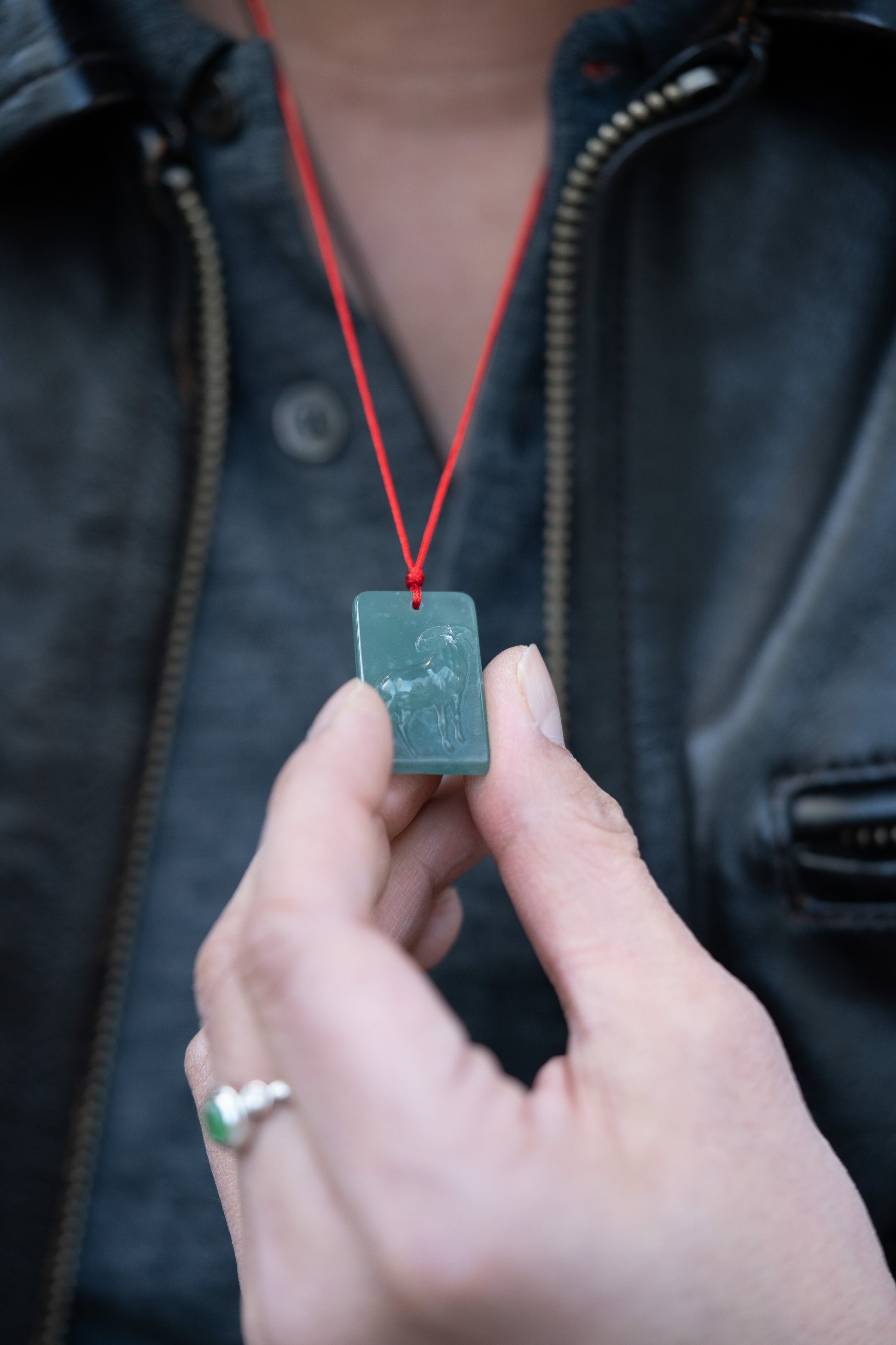 Zodiac Goat in Bluish Green Jadeite Jade Pendant hung on a red string 