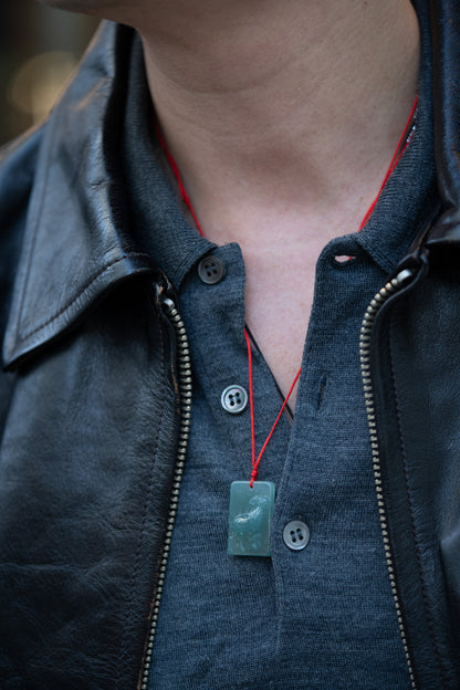 Zodiac Goat in Bluish Green Jadeite Jade Pendant hung on a red string 