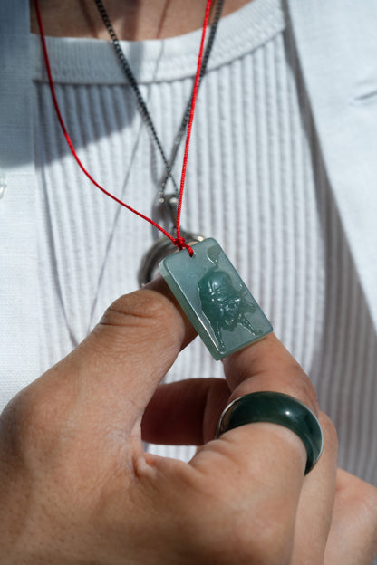 Zodiac Ox in Bluish Green Jadeite Jade Pendant hung on a red string