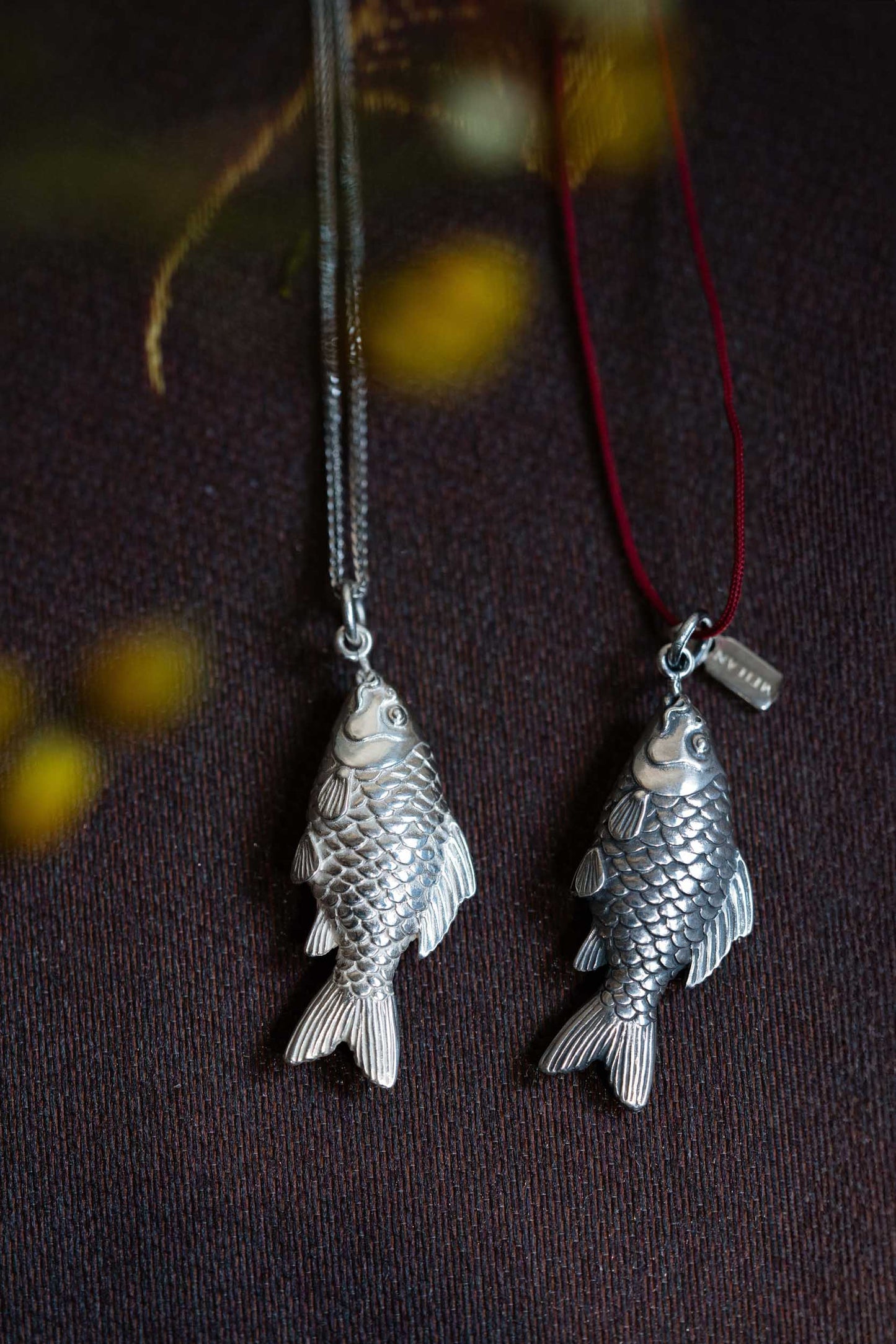 High Shine Finish 925 Silver Carved Fish Pendant hung on a Sterling Silver Chain
Aged Finish Silver Carved Fish Pendant with Meilan Tag hung on a red rope