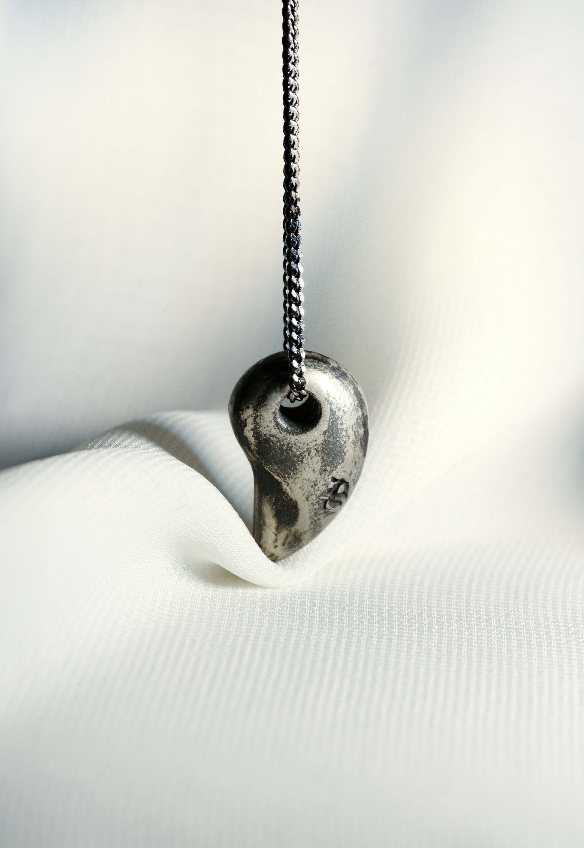 Sterling Silver Comma hung on a 925 Silver Chain