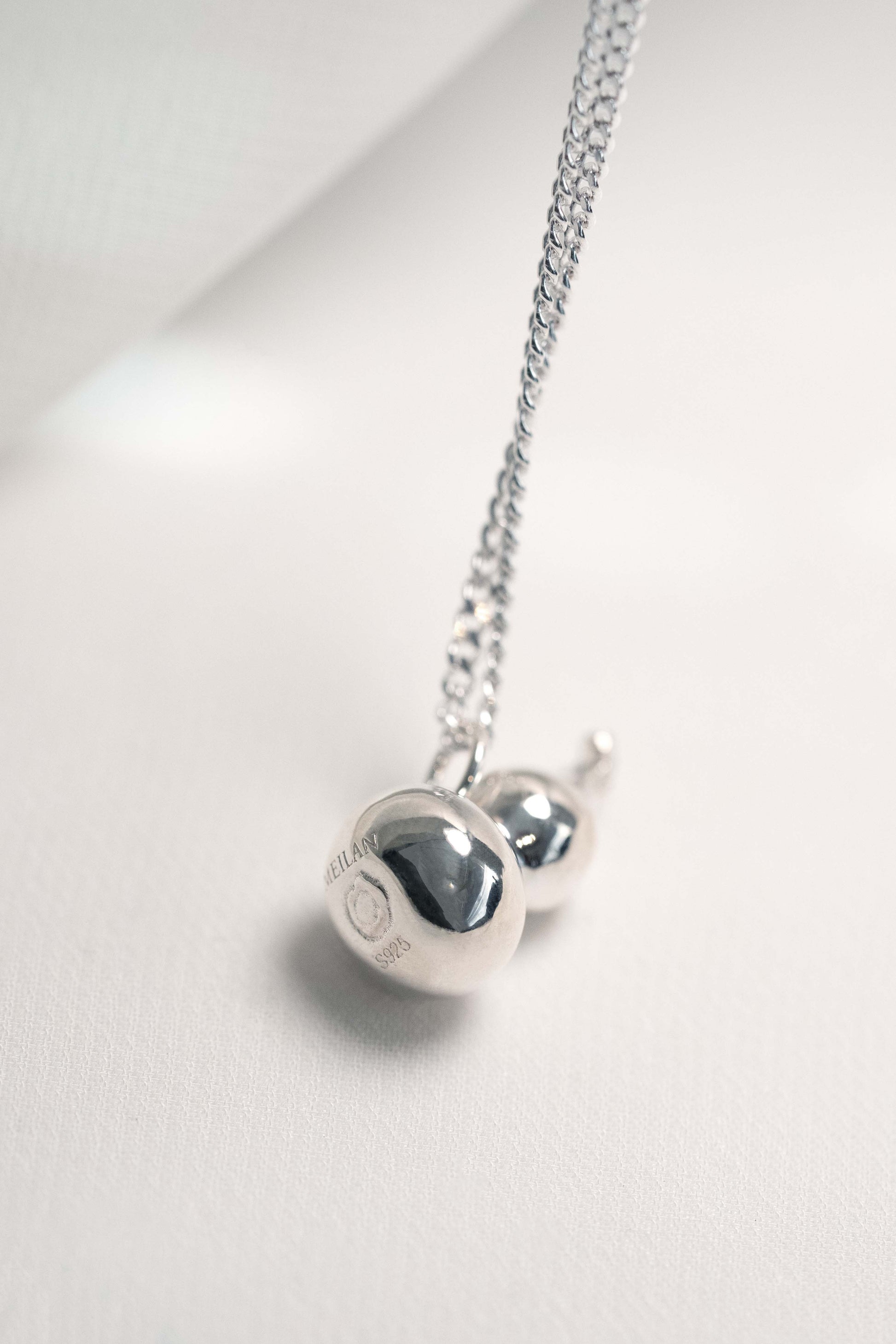 Sterling Silver Wulu Pendant hung on a 925 Silver Chain