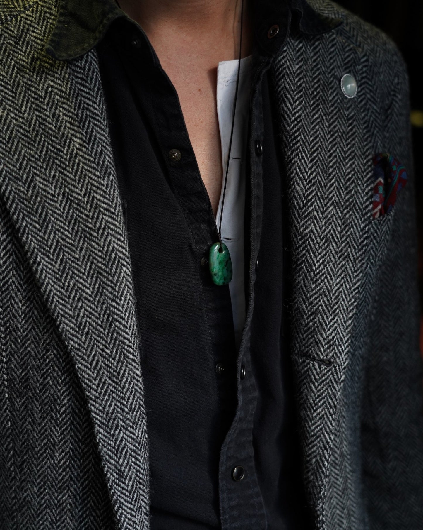 Pale Green Oval Jadeite Tag with Bright and Intense Green Patches